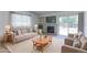 Comfortable living room with a fireplace, large TV, and sliding glass doors to the yard at 12935 Lake Circle Dr, Thornton, CO 80241