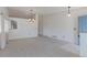 Bright living room with neutral carpet, a chandelier, and a view of the hallway at 12935 Lake Circle Dr, Thornton, CO 80241
