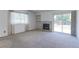 Bright living room features a fireplace, large window, and access to the backyard at 12935 Lake Circle Dr, Thornton, CO 80241