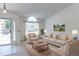 Bright living room featuring large windows, neutral decor, and comfortable seating at 12935 Lake Circle Dr, Thornton, CO 80241