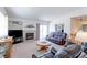 Comfortable living room with a fireplace and sliding glass doors at 12935 Lake Circle Dr, Thornton, CO 80241
