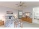 This bedroom is designed for comfort with it's relaxing decor, natural light, and connected bathroom at 12935 Lake Circle Dr, Thornton, CO 80241