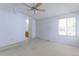 Bright bedroom with large windows and an ensuite bathroom at 12935 Lake Circle Dr, Thornton, CO 80241
