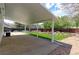 Enjoy the covered patio overlooking the beautifully landscaped backyard with mature trees, lush grass, and a rock feature at 12935 Lake Circle Dr, Thornton, CO 80241