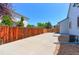 Property featuring a private sideyard with concrete pad and tall wooden fence, perfect for RV or boat storage at 12935 Lake Circle Dr, Thornton, CO 80241