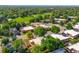 Community aerial view showcasing lush green spaces, golf course, and well-maintained townhomes at 1490 S Salem Way, Aurora, CO 80012