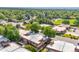 Aerial shot of a vibrant community with lush trees, well-kept streets, and charming townhomes at 1490 S Salem Way, Aurora, CO 80012