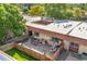 Aerial view highlighting the well-maintained backyard, landscaping, and patio area of a townhouse at 1490 S Salem Way, Aurora, CO 80012