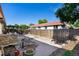 This backyard features a lush garden, stone accents, walkway, and privacy fence for serene outdoor living at 1490 S Salem Way, Aurora, CO 80012
