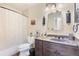 This bathroom features a single sink vanity, and a shower with a shower curtain at 1490 S Salem Way, Aurora, CO 80012