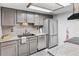 Modern kitchen featuring granite countertops, stainless steel appliances, and ample storage space at 1490 S Salem Way, Aurora, CO 80012