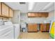 Bright laundry room with ample cabinet space and countertop for folding at 1490 S Salem Way, Aurora, CO 80012