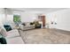 Well-lit living room offering stylish furniture, chic decor, and an open layout, perfect for entertaining guests at 1490 S Salem Way, Aurora, CO 80012