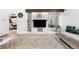 Cozy living space with a decorative fireplace, built-in shelving, and an abundance of natural light at 1490 S Salem Way, Aurora, CO 80012