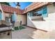 Charming outdoor patio featuring tile flooring and dining area with a grill, perfect for entertaining at 1490 S Salem Way, Aurora, CO 80012