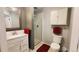 Updated bathroom features a vanity, granite counters, framed mirror and glass enclosed shower at 475 W 12Th Ave # 8H, Denver, CO 80204
