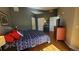 Comfortable bedroom with wood floors, modern decor, and plenty of natural light at 475 W 12Th Ave # 8H, Denver, CO 80204