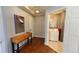 Entryway showing console table and artwork, leading into a bathroom and other living spaces at 475 W 12Th Ave # 8H, Denver, CO 80204