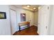 Hallway with hardwood floors, console table, modern decor and a view of the entry door at 475 W 12Th Ave # 8H, Denver, CO 80204