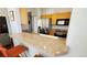 Eat-in kitchen with bar seating, stainless steel appliances, and modern countertops at 475 W 12Th Ave # 8H, Denver, CO 80204