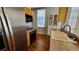 Bright kitchen with stainless steel refrigerator and modern appliances at 475 W 12Th Ave # 8H, Denver, CO 80204