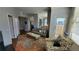 Living room featuring a cozy sofa, stylish rug, and access to the balcony at 475 W 12Th Ave # 8H, Denver, CO 80204