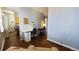 Open living room area with hardwood flooring, desk, and lots of natural light at 475 W 12Th Ave # 8H, Denver, CO 80204