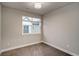 This bedroom features a large window and neutral carpeting at 5185 Vivian St, Wheat Ridge, CO 80033