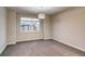 This bedroom features a large window and a decorative light fixture at 5185 Vivian St, Wheat Ridge, CO 80033