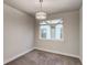 Bedroom with a decorative light fixture and view of neighborhood at 5185 Vivian St, Wheat Ridge, CO 80033