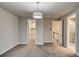 Bedroom with two doors and decorative light fixture at 5185 Vivian St, Wheat Ridge, CO 80033