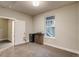 A comfortable bedroom with a window, neutral paint, mini-fridge and wine storage at 5185 Vivian St, Wheat Ridge, CO 80033