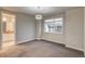 Bedroom features a large window and view into ensuite bathroom at 5185 Vivian St, Wheat Ridge, CO 80033