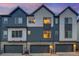 Modern townhomes featuring attached garages, and contemporary architecture at 5185 Vivian St, Wheat Ridge, CO 80033