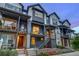 Charming multi-level townhome with modern design elements and well-kept landscaping at 5185 Vivian St, Wheat Ridge, CO 80033