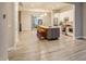 Open-concept kitchen and living area with modern finishes and natural light at 5185 Vivian St, Wheat Ridge, CO 80033