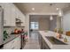Stylish kitchen boasting modern appliances, quartz countertops and a large island at 5185 Vivian St, Wheat Ridge, CO 80033