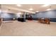 Spacious finished basement offering versatile living space with cozy sitting area and potential for entertainment at 10366 E Ida Ave, Greenwood Village, CO 80111