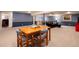 Basement room with space for gaming or dining with a seating area and kitchenette at 10366 E Ida Ave, Greenwood Village, CO 80111
