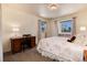 Bright bedroom features two windows with light filtering in and desk area for convenient home working at 10366 E Ida Ave, Greenwood Village, CO 80111