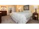 Comfortable bedroom featuring floral bedding, wood furniture, and an ensuite bathroom at 10366 E Ida Ave, Greenwood Village, CO 80111