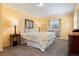 Cozy bedroom with floral bedding, wood furniture, and built-in shelves at 10366 E Ida Ave, Greenwood Village, CO 80111