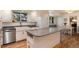 Modern kitchen featuring white cabinets, granite countertops and a center island at 10366 E Ida Ave, Greenwood Village, CO 80111