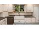 Bright kitchen featuring granite countertops, modern fixtures and an island at 10366 E Ida Ave, Greenwood Village, CO 80111