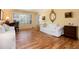 Well-lit living room with hardwood floors, large windows, and stylish decor at 10366 E Ida Ave, Greenwood Village, CO 80111