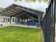 Community picnic area featuring picnic tables and chairs beneath a large awning at 10366 E Ida Ave, Greenwood Village, CO 80111