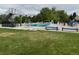 Community pool featuring a diving board, chairs for lounging, and well-manicured grassy areas at 10366 E Ida Ave, Greenwood Village, CO 80111