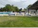 The community pool includes a seating area, sun bathing loungers, and a shady picnic structure at 10366 E Ida Ave, Greenwood Village, CO 80111