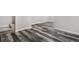 Spacious basement with grey laminate wood flooring at 1811 S Quebec Way # 151, Denver, CO 80231