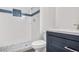 Bathroom with white subway tile and navy vanity at 1811 S Quebec Way # 151, Denver, CO 80231